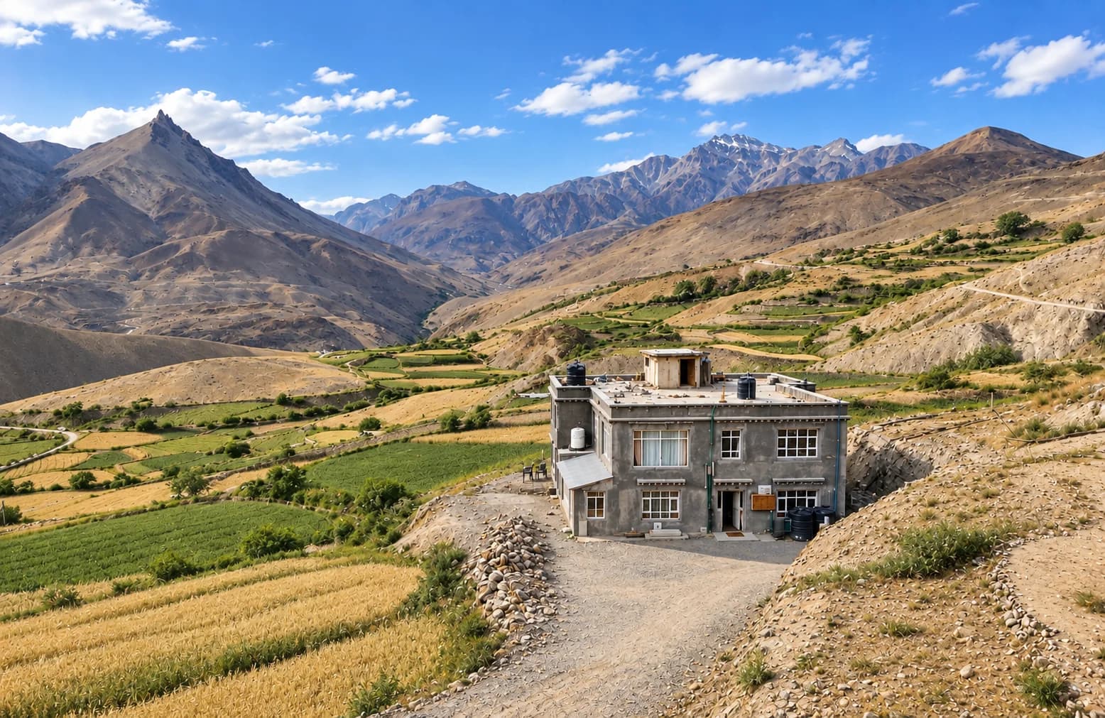 Kibber House surrounded by fields and the mountains of Spiti
